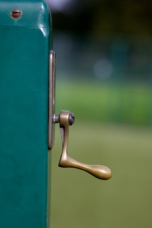 Tennis court net with green post with handle to move net higher or lower.の写真素材
