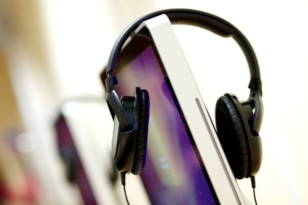 Isolated audio head phones on a desktop computer in a University libraryの写真素材