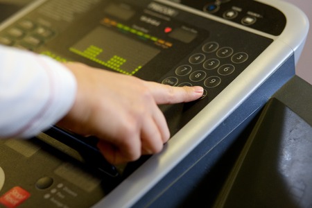 Close up of a touch pad technology on a cross trainer in a gymの写真素材