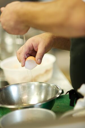 Fine dining food and drink being prepared and displayed in classic white crockery in a kitchen environment,の写真素材