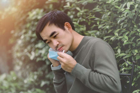 Men wearing surgical face mask to protect of  virus outbreak Infection and Pandemic , social distancing and new normal conceptの写真素材