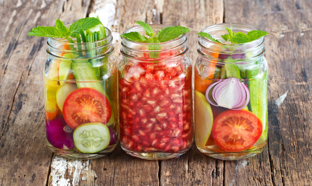 Three mug delicious refreshing drink of mix fruits and herb on woodenの写真素材