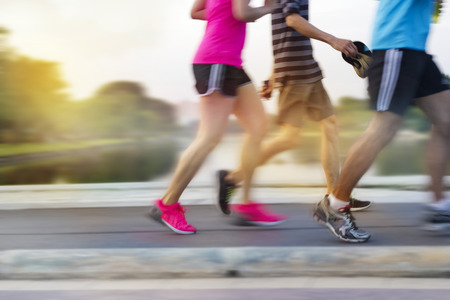 abstract colorful people running in the park, pastel and blur conceptの写真素材