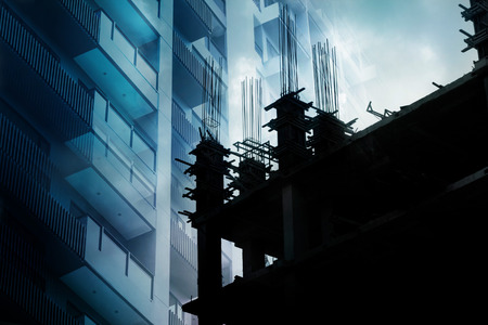 Building vibrant and under construction at dark tone, double exposure soft and blue conceptの写真素材