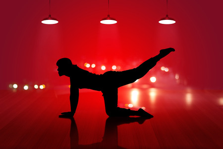 woman yoga silhouette exercise on wooden floor red background, soft and blur conceptの写真素材