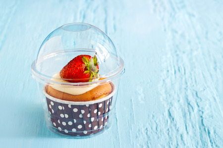strawberry cake on blue paint wooden background, soft and blur blue toneの写真素材