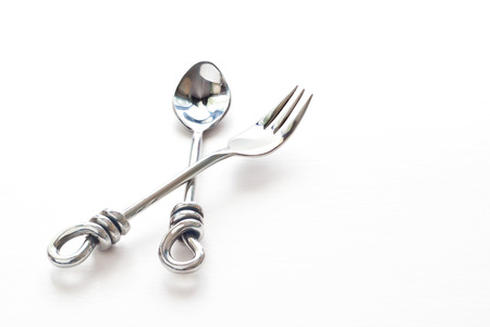 spoon and fork hand made Stainless steel modern style on white paper backgroundの写真素材