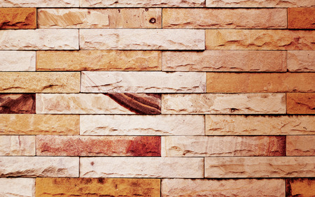 vintage color tone modern stone wall for background, warm tone conceptの写真素材