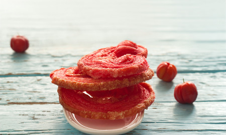 Red flavored puffed fried on blue wooden backgroundの写真素材