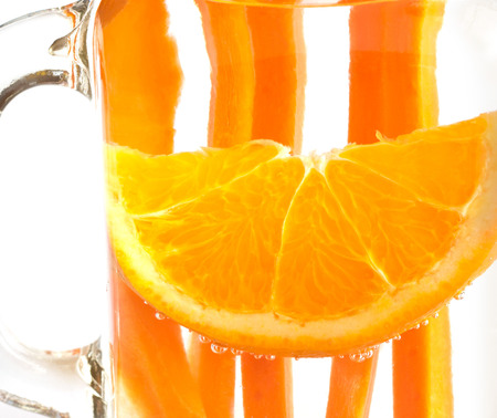 orange with carrot in water mug, infusion water, soft focusの写真素材