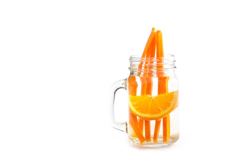 orange with carrot in water mug, infusion water, soft focusの写真素材