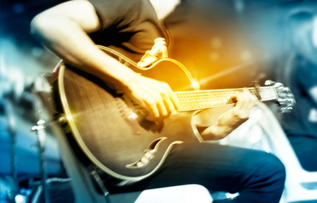 Guitarist on stage for background, vibrant soft and motion blur conceptの写真素材