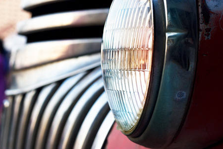 Colorful head light vintage car on dark tone, soft focus and blurの写真素材