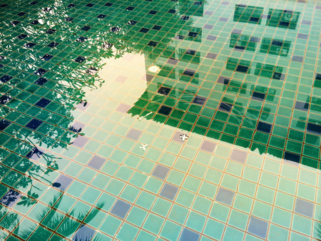 abstract reflection building in the water in colorful swimming poolの写真素材