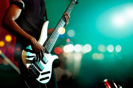 Guitarist bass on stage for background, colorful, soft focus and blur conceptの写真素材