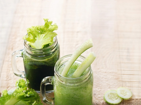 smoothie detox lettuce and cucumber on wooden backgroundの写真素材