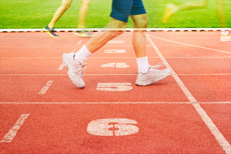 Number lanes track and athlete running on number lanes, Double exposure, Soft focus and blurの写真素材