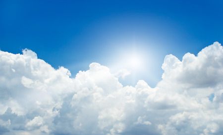 blue sky with cloud and sunbeam in summerの写真素材