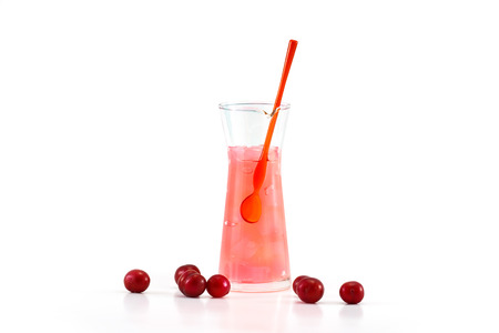 Glass of tasty jelly coconut with asian cherry on white backgroundの写真素材