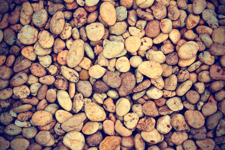 Texture of pebbles or of gravel stone from water fall for backgroundの写真素材