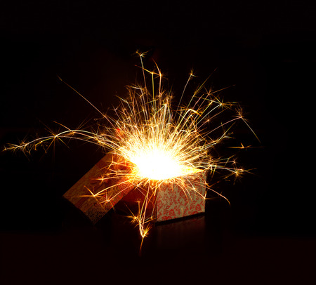 Open gift box and light fireworks christmas on dark background, Merry Christmas and Happy New Yearの写真素材