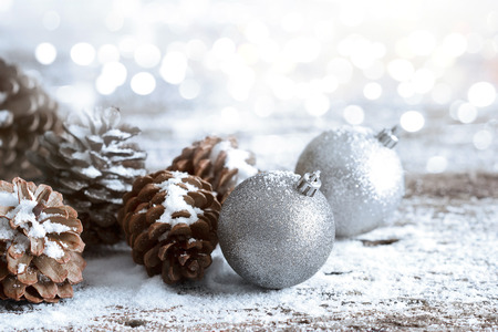 Christmas ornament pine cones; Winter background with frost fir branchの写真素材