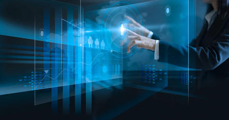 business woman touching virtual screen, pushing icon on media at dark backgroundの写真素材