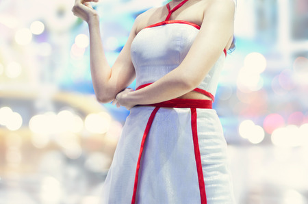 woman with sexy clothes in the city on bokeh background, soft focus and blurの写真素材