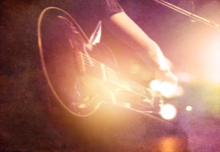 Guitarist on stage on paper grin background, soft and blur conceptの写真素材