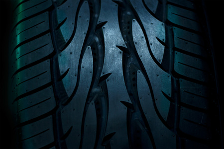 close up car tyres on dark backgroundの写真素材