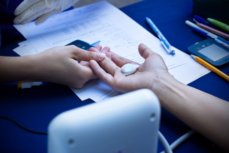 doctor checking woman patient arterial blood pressure, Health care conceptの写真素材