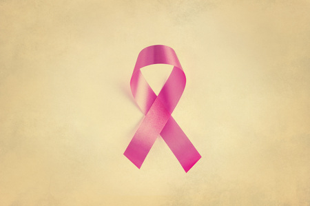 Rink ribbon, breast cancer awareness symbol, Vintage on paper grain backgroundの写真素材