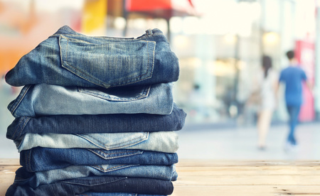 jeans in shop on wooden and shopping store backgroundの写真素材