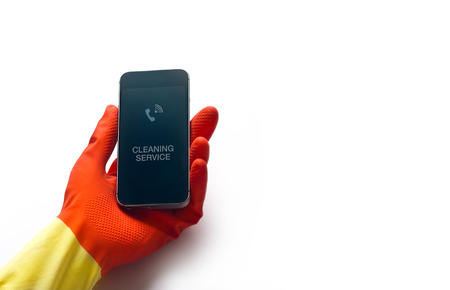 cleaning service by smart phone on white background, blank textの写真素材