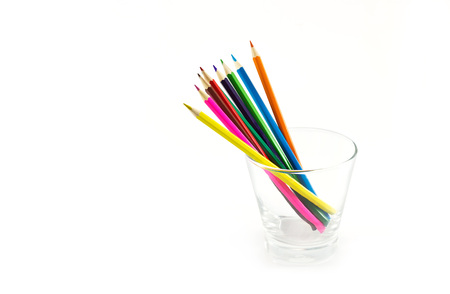 Colorful pencils in glass on white backgroundの写真素材