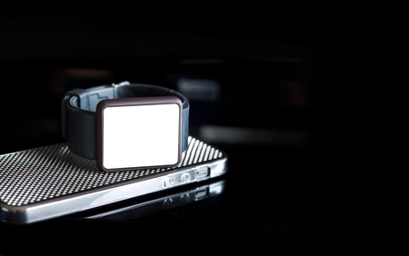 Smart watch on dark background, blank textの写真素材
