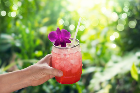 Colorful cool drink in summer on nature background