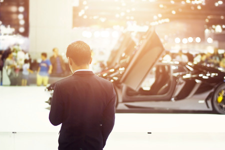 business man in sport car showroomの写真素材
