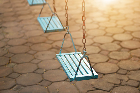 Closeup of swings in the park of morningの写真素材