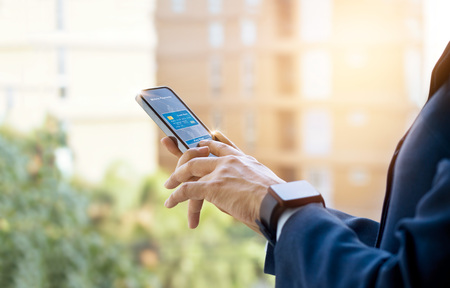 People online payment using smartphone and credit card on city backgroundの写真素材