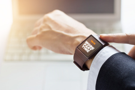 Businessman with work part time word on smartwatch screenの写真素材