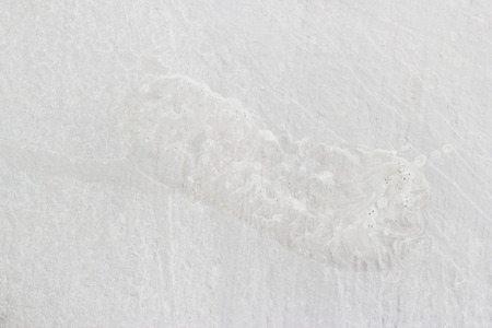 Human footprint on white cement floorの写真素材