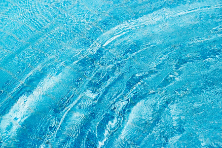 Blue wave water in swimming poolの写真素材
