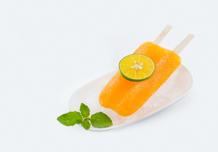 Tangerine orange with ice and citrus fruits on white background.の写真素材
