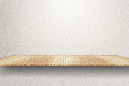 Empty wood shelf on white wallの写真素材