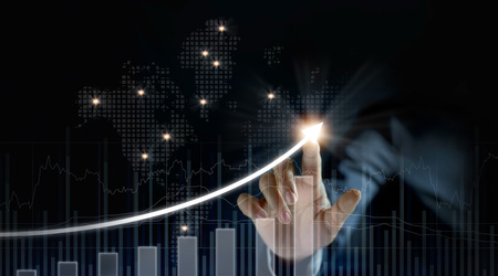 Businessman plan growth and increase of positive indicators on dark backgroundの写真素材