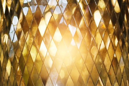 Shining golden mosaic glass backgroundの写真素材