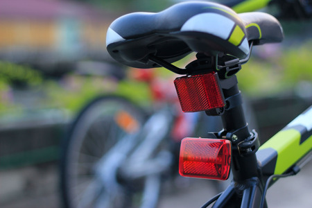 Back lights bicycle on street backgroundの写真素材