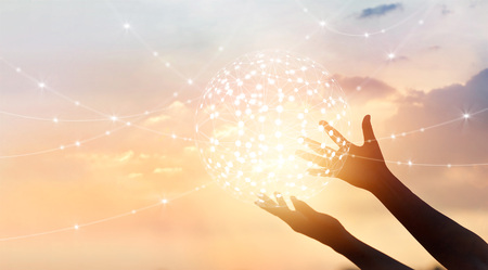 Abstract science, circle global network connection in hands on sunset backgroundの写真素材