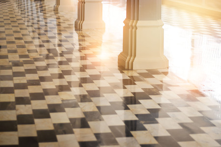 Cathedral porch balcony with morning warm lighting and reflection of its on floorの写真素材